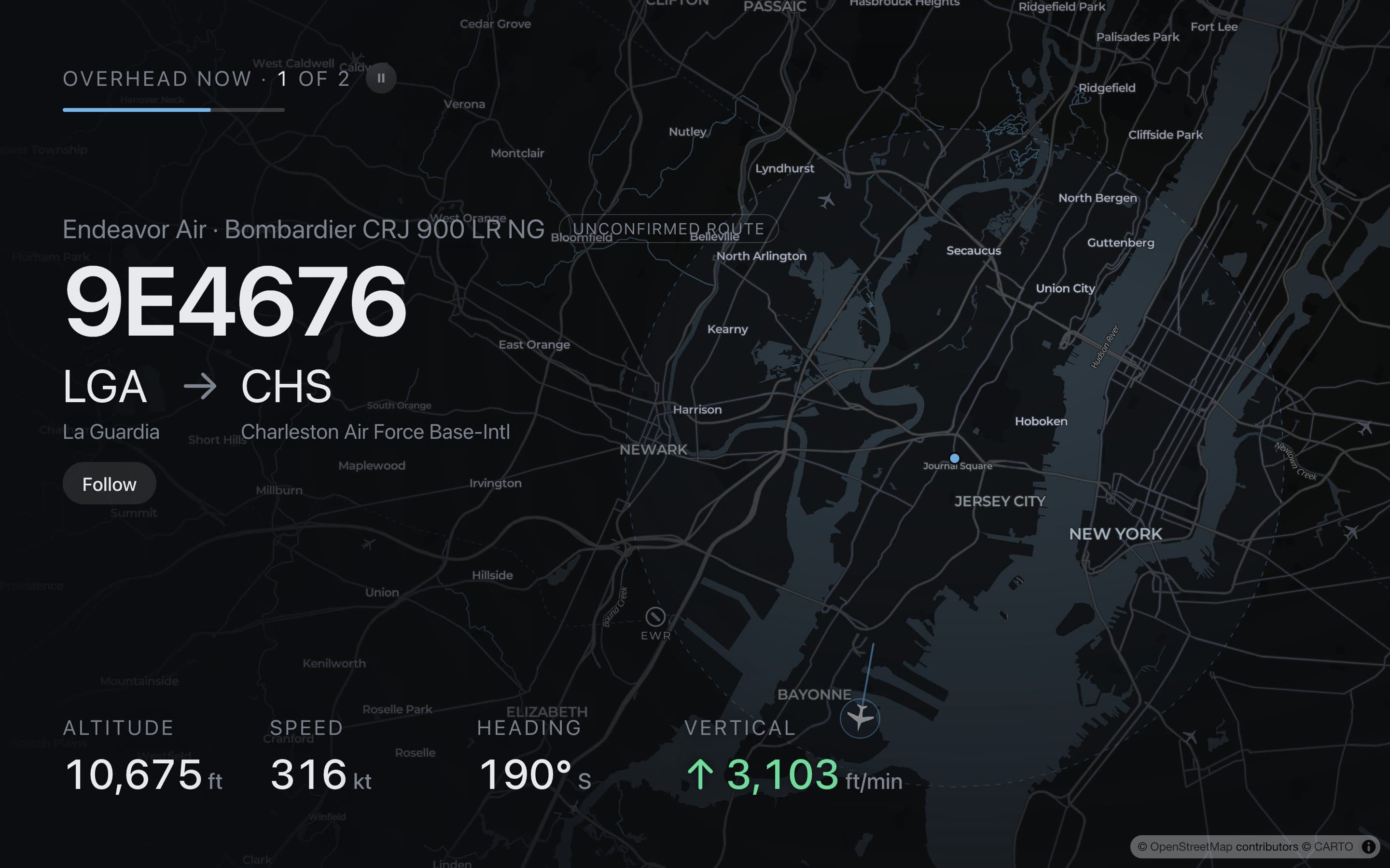 The WingWatch wall on a TV: a dark map of the sky with the plane overhead and its flight card